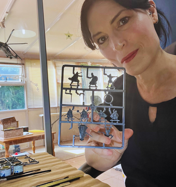 Amanda holding Lord of the Rings mini figurines